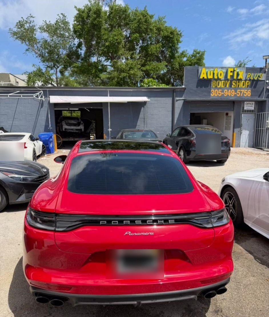 AutoFix Plus Body Shop storefront in North Miami Beach with a red Porsche parked outside