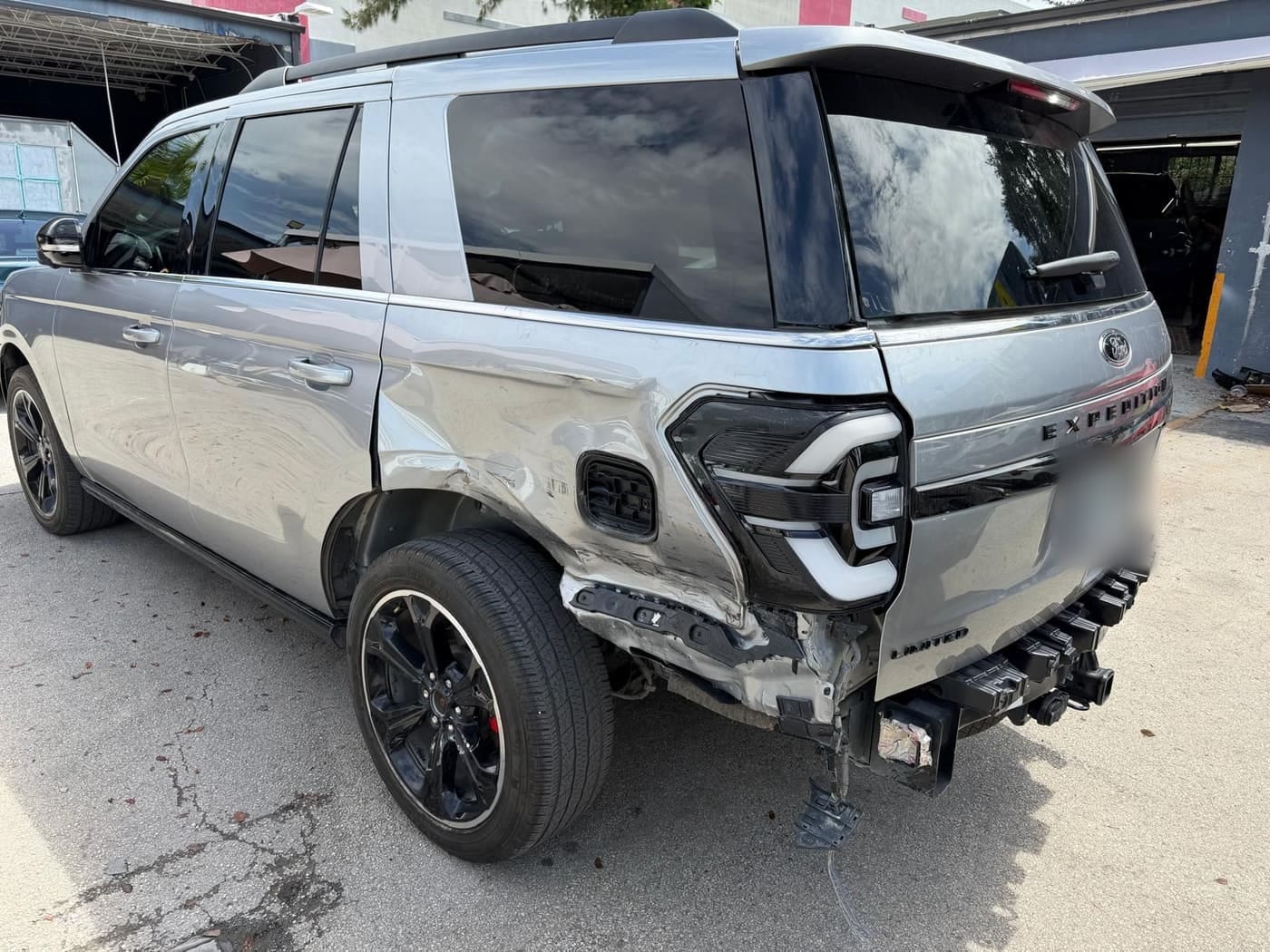 The same Ford Expedition before repair, showing collision damage