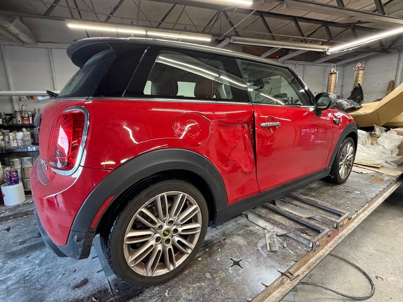 The same Mini Cooper before repair, showing collision damage